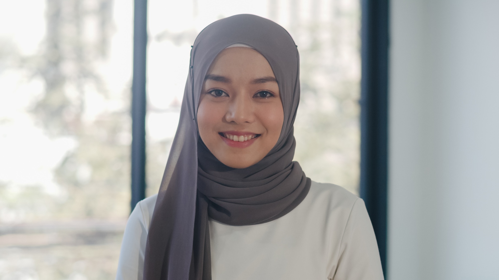 Portrait of successful beautiful executive businesswoman looking at camera and smile in office.